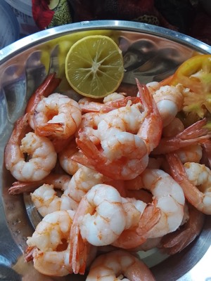 A bowl of fresh prawns with a wedge of lime, straight off the boats.